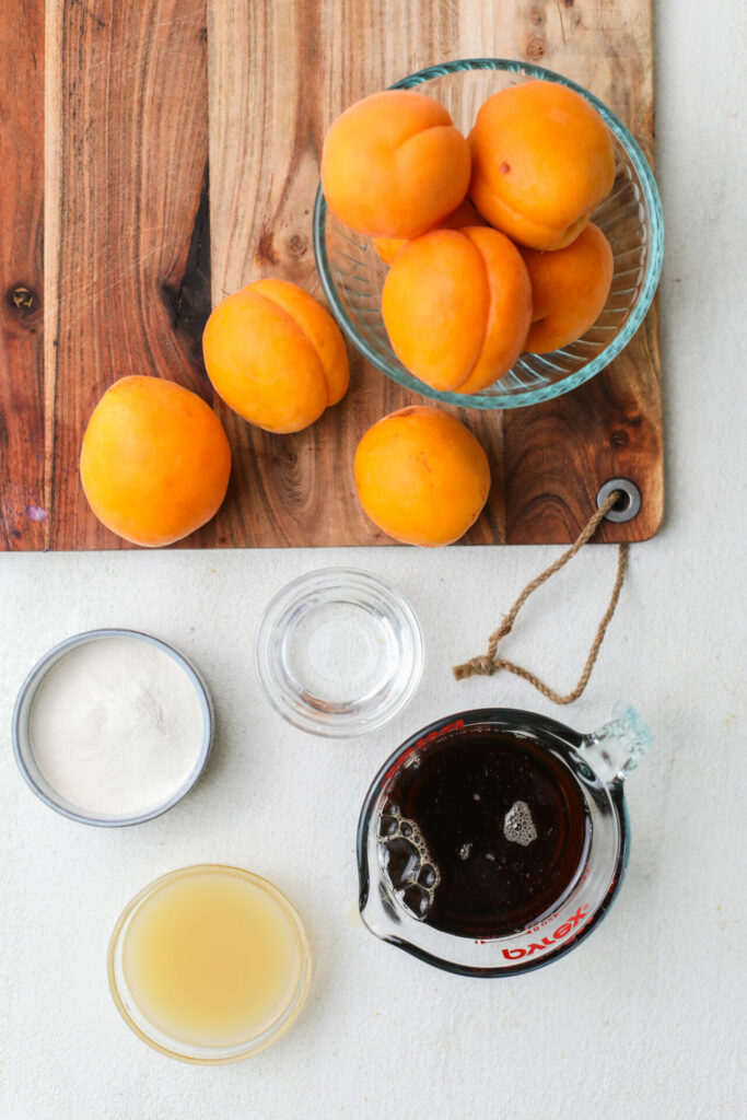 Apricot Jam ingredients sitting on a cutting board and countertop