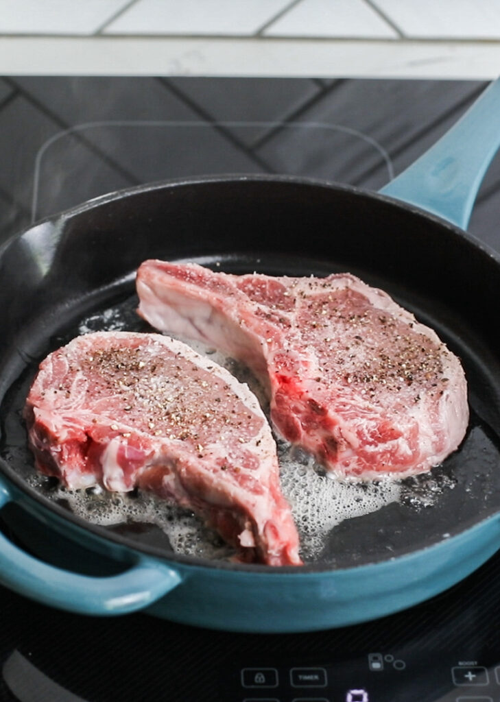Pork Chops being seared in a pan on a Sharp Induction Cooktop (SCH3043GB)