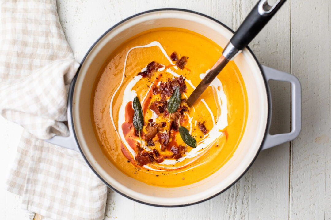 An image of Sunkissed Kitchen's butternut squash and roasted red pepper soup.