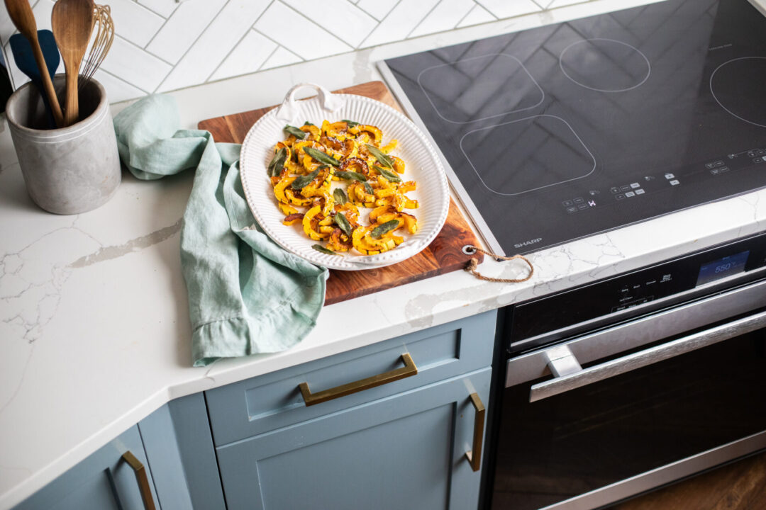 Sauteed Declicata Squash with Cripsy Fried sage next to a Sharp Induction Cooktop