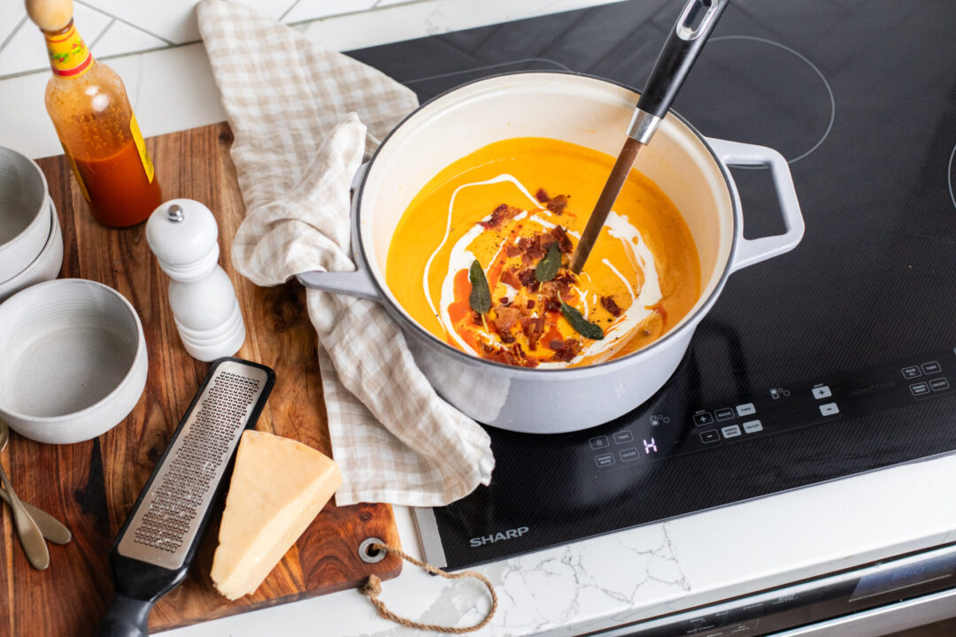 Butternut squash red pepper soup in a pot on a Sharp Induction Cooktop