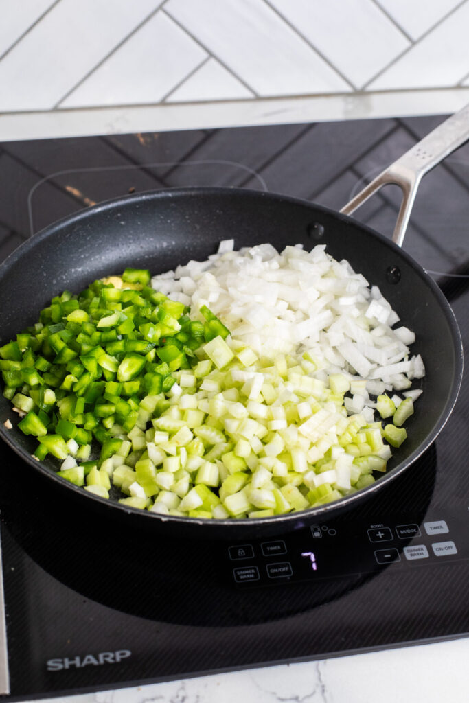 Ingredients for stuffing in a pan on a Sharp Induction Cooktop