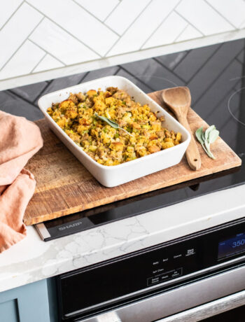 Sausage cornbread stuffing in a serving dish on a Sharp Cooktop
