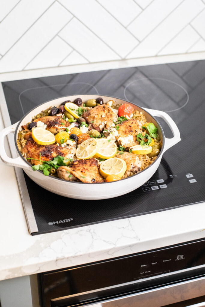 One pan Greek Chicken and rice cooked sititng on a Sharp Induction Cooktop