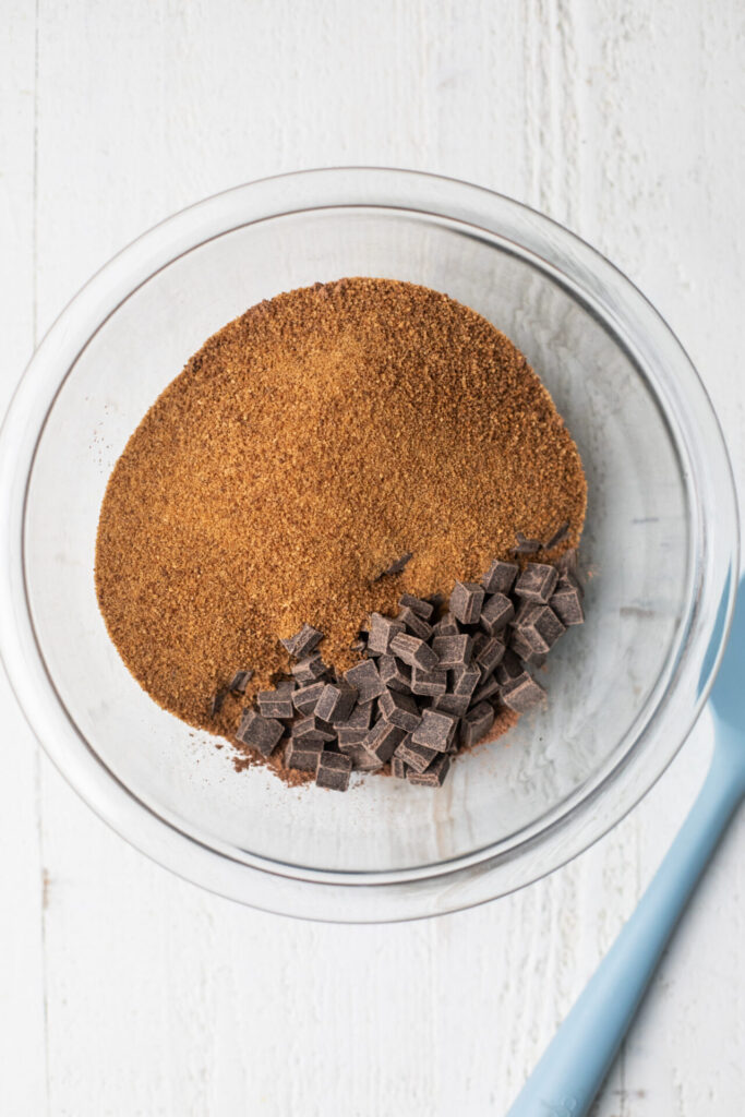 Dark chocolate, cacao powder, coconut sugar, and coconut oil in a heatproof bowl