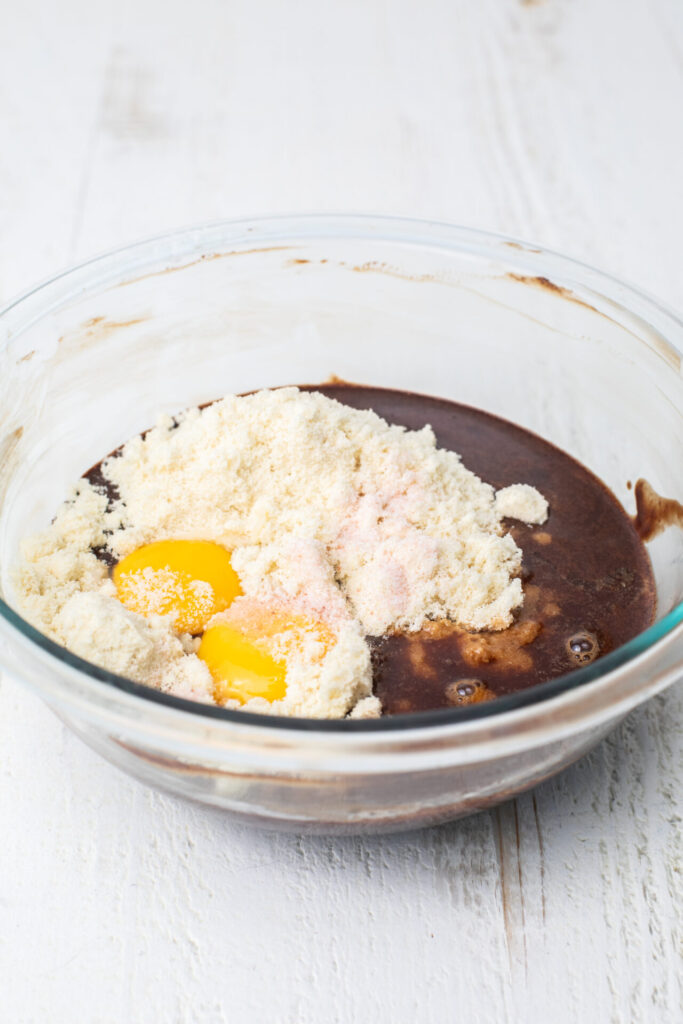 Egg yolks, almond flour, and vanilla extract in a mixing bowl