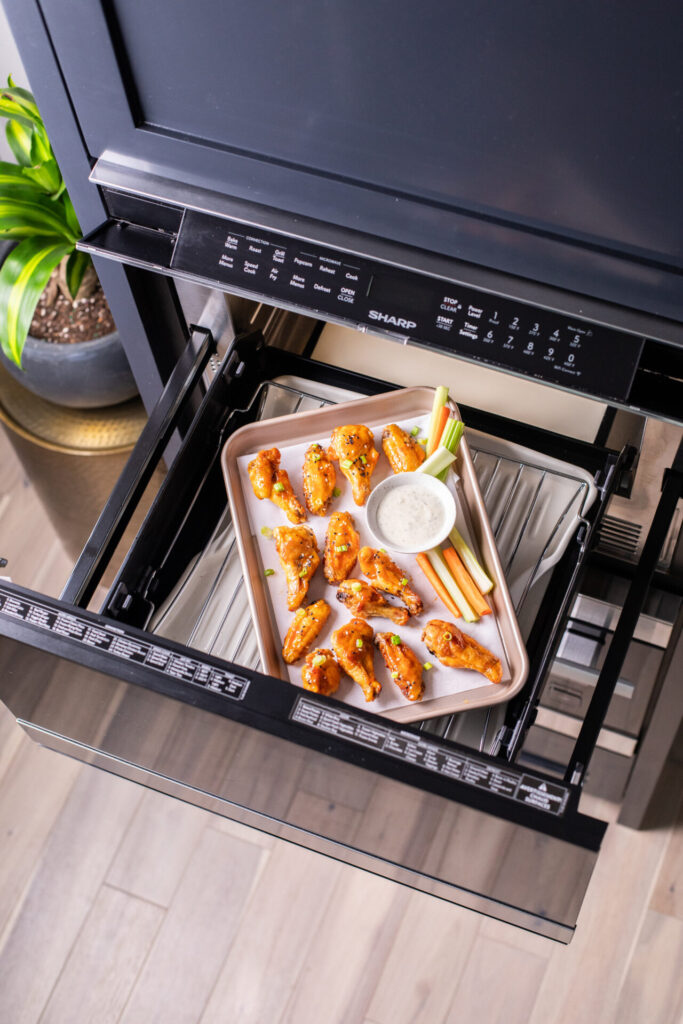 Honey chicken wings on a tray in a Sharp Convection Microwave Drawer Oven