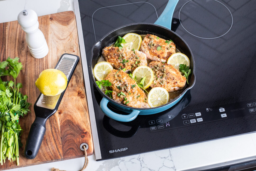 Pork piccata in a pan on a Sharp induction cooktop