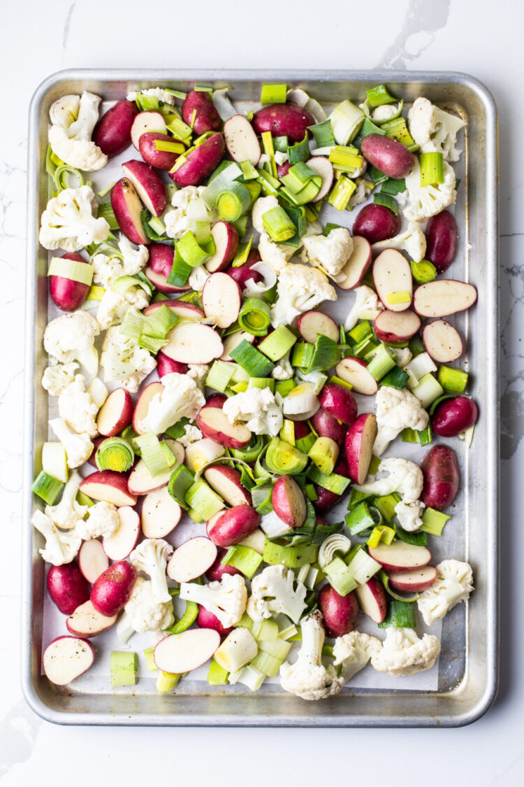 Ingredients for roasted spring vegetables in a sheet pan