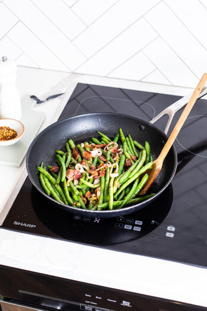 Bacon Green beans in a frying pan on a sharp induction cooktop