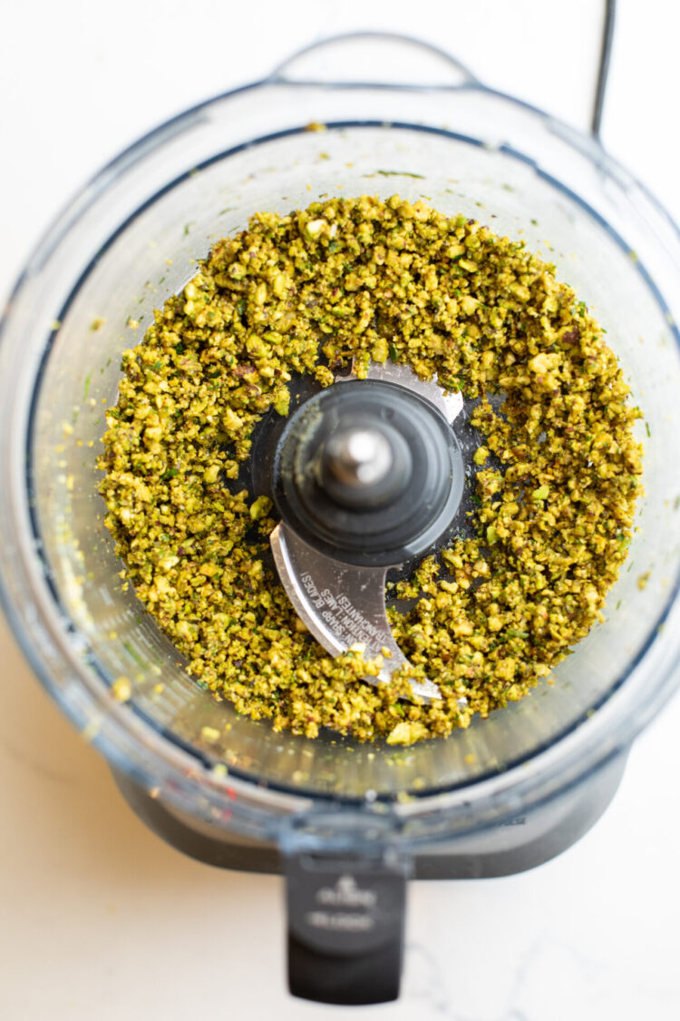 Pistachios being crushed in a food processor