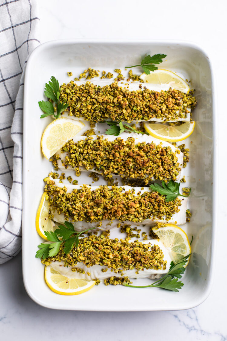 Pistachio crusted halibut in a cooking dish