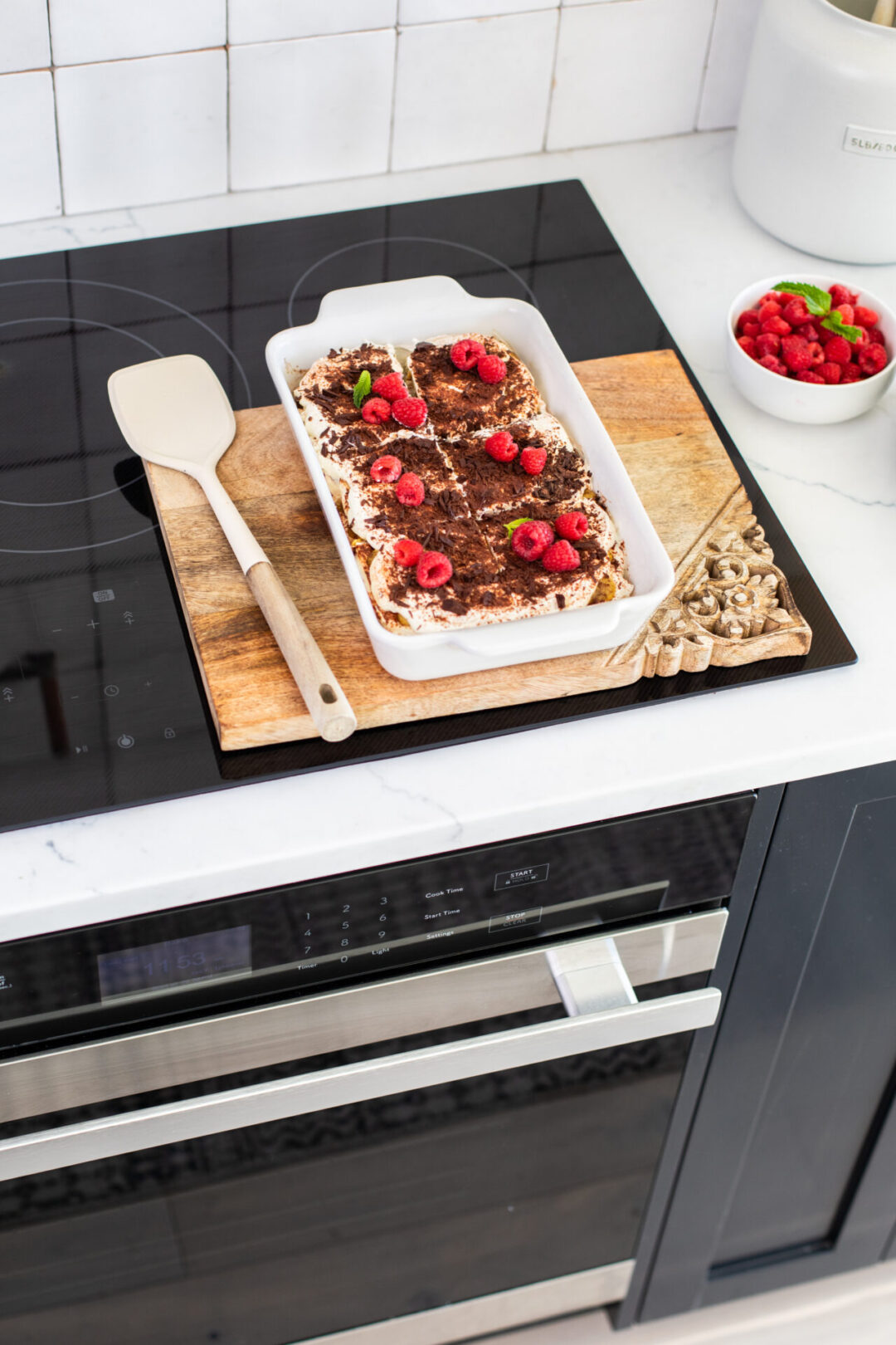 Tiramisu on a white pan on top of a SHARP induction