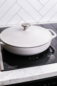 Saucepan covered with lid on induction cooktop