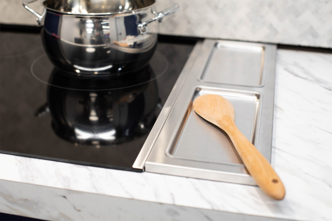 wooden spoon next to Sharp radiant cooktop
