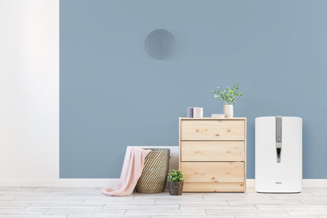 air purifier in a room next to dresser