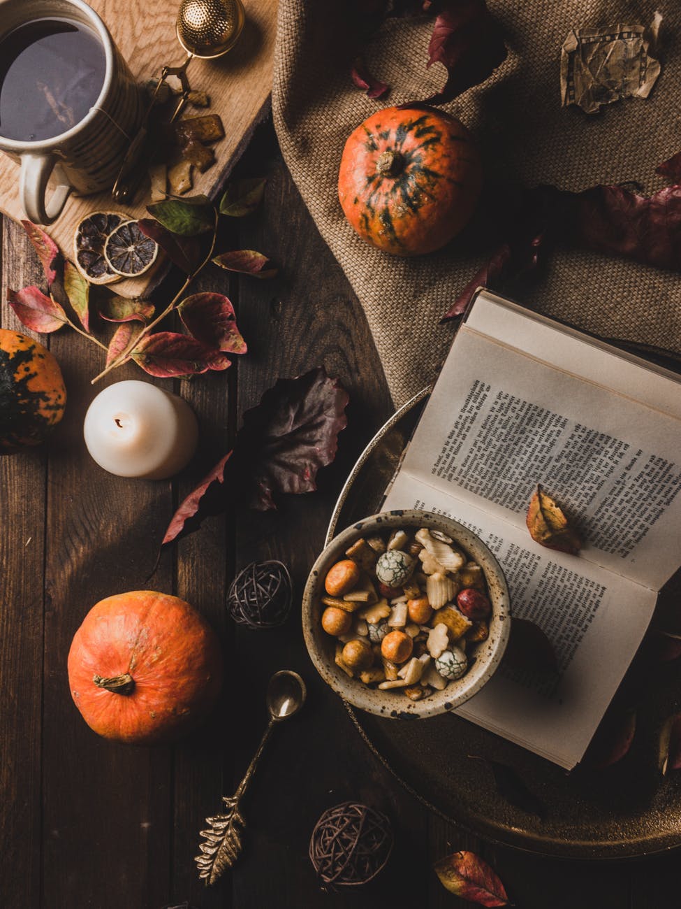 book with pumpkins and other fall decorations