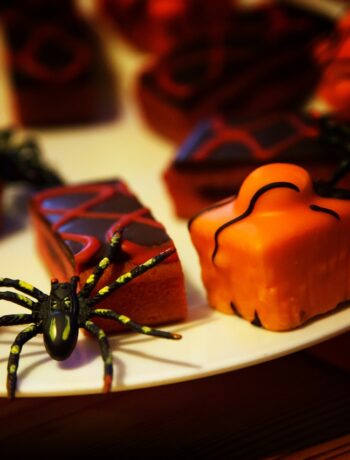 halloween candy on a plate with a toy spider