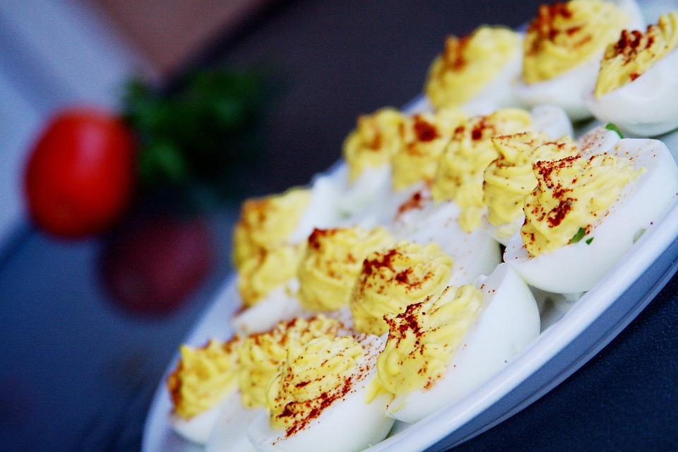 Deviled eggs on a plate sideways.