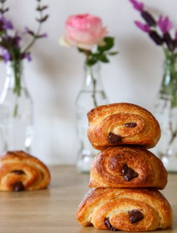 stack of pain au chocolat pastries on a table