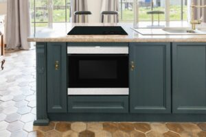 Sharp SMD2499 Microwave Drawer in a kitchen with green cabinets 