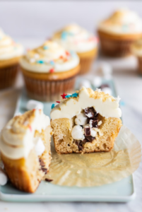 Gluten-Free S’mores Cupcakes cut in half on a plate.