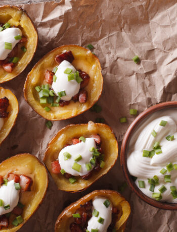 baked potato skins with bacon and sour cream on top
