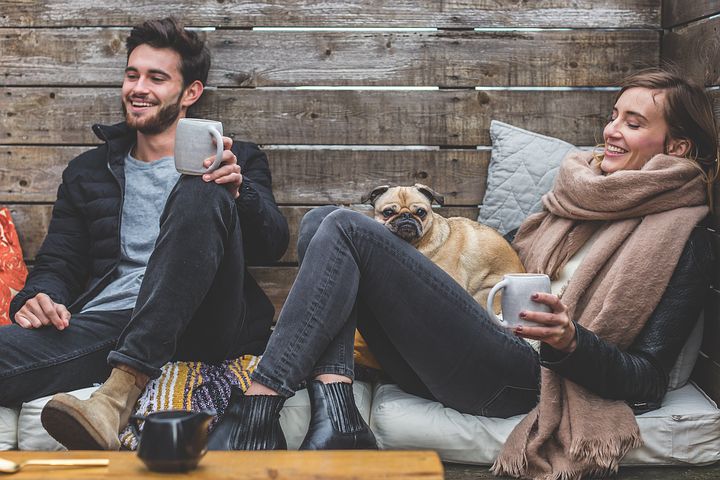 man and woman with their dog