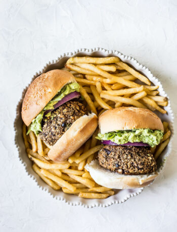 veggie burgers in a bowl with french fries