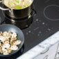 30-Inch Black Induction Cooktop (SDH3042DB) – preparing a meal on the Sharp 30” induction cooktop