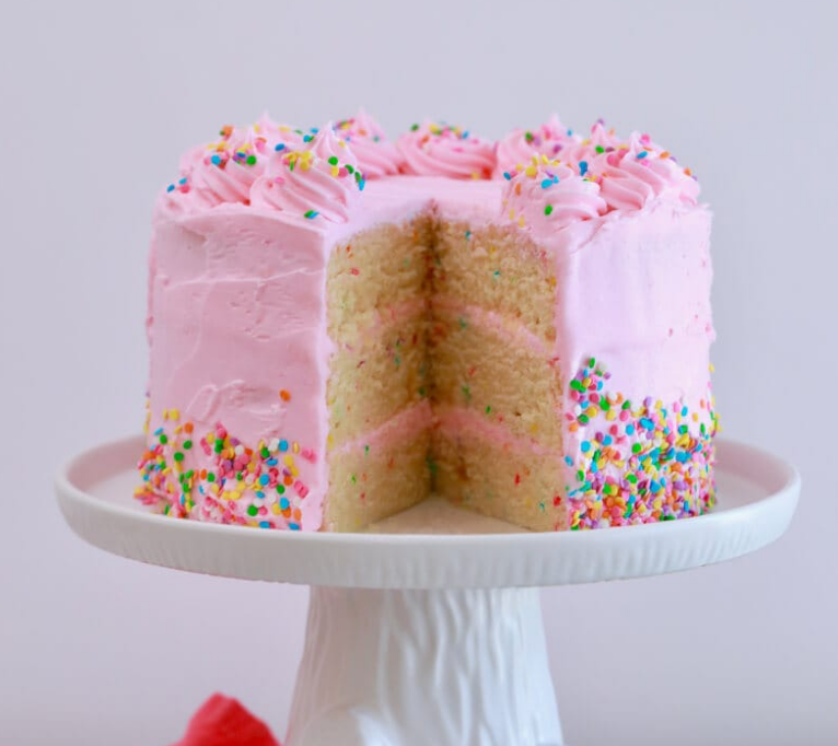 pink vanilla cake cut