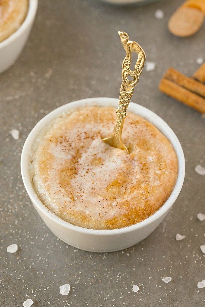 Cinnamon Roll Mug Cake with a golden spoon