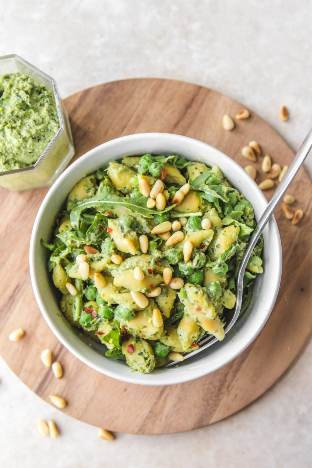 Pea Pesto Pasta in a bowl on a wooden surface