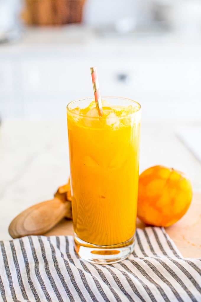 Anti-Inflammatory Tumeric Tonic in Orange Juice glass