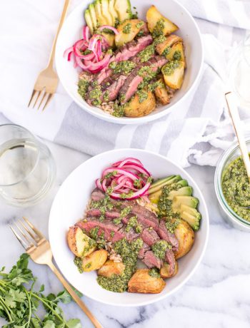 Chimichurri Steak Bowls with Roasted Potatoes in two bowls with forks