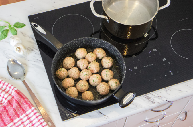 Turkish meatballs being prepared on a Sharp Induction Cooktop.