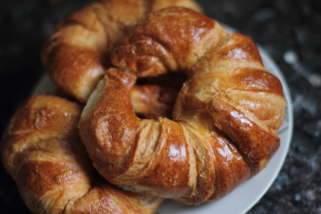 Croissants on a white plate.