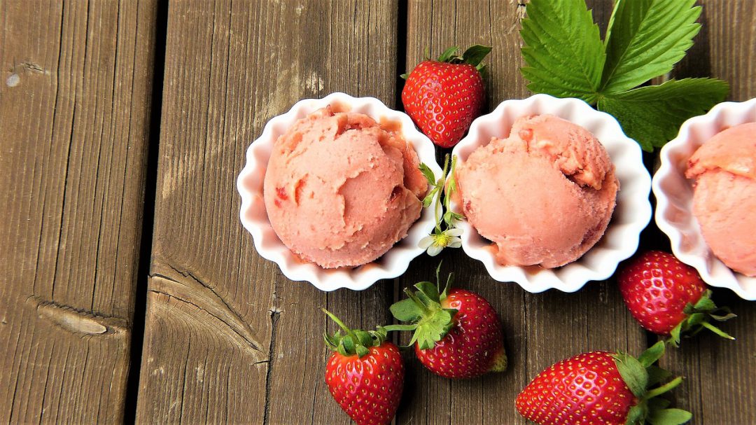 Strawberry ice cream with strawberries.
