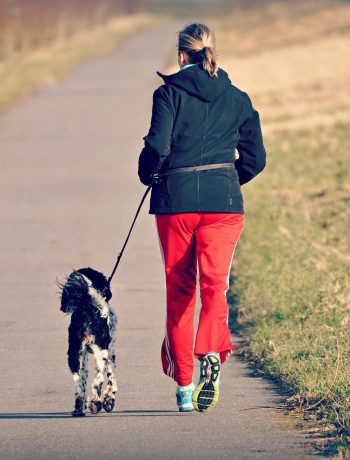 Woman running with a dog.