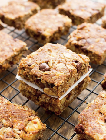 Breakfast bars with almonds spread across a rack.