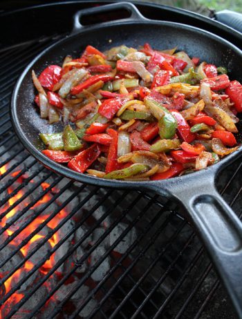 Cast iron with vegetables on a grille.