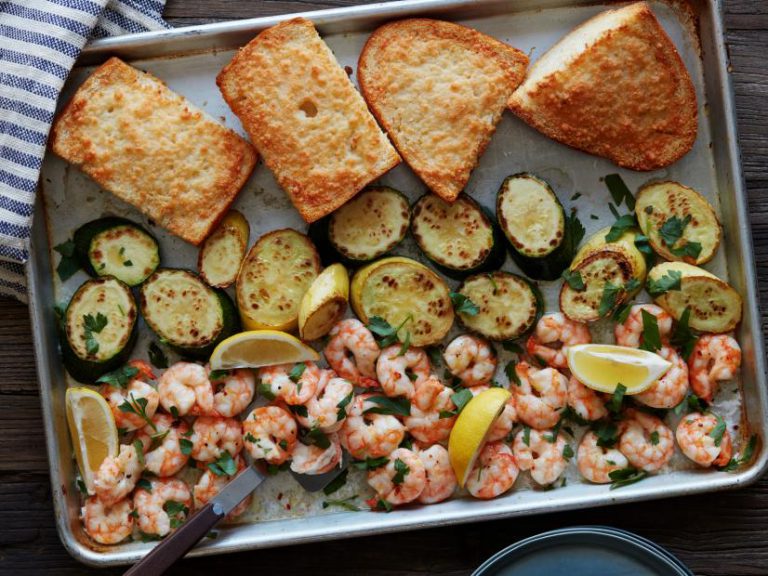 Sheetpan Shrimp Scampi spread out on a pan.