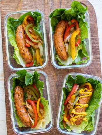 Sausage wraps in lettuce in containers.