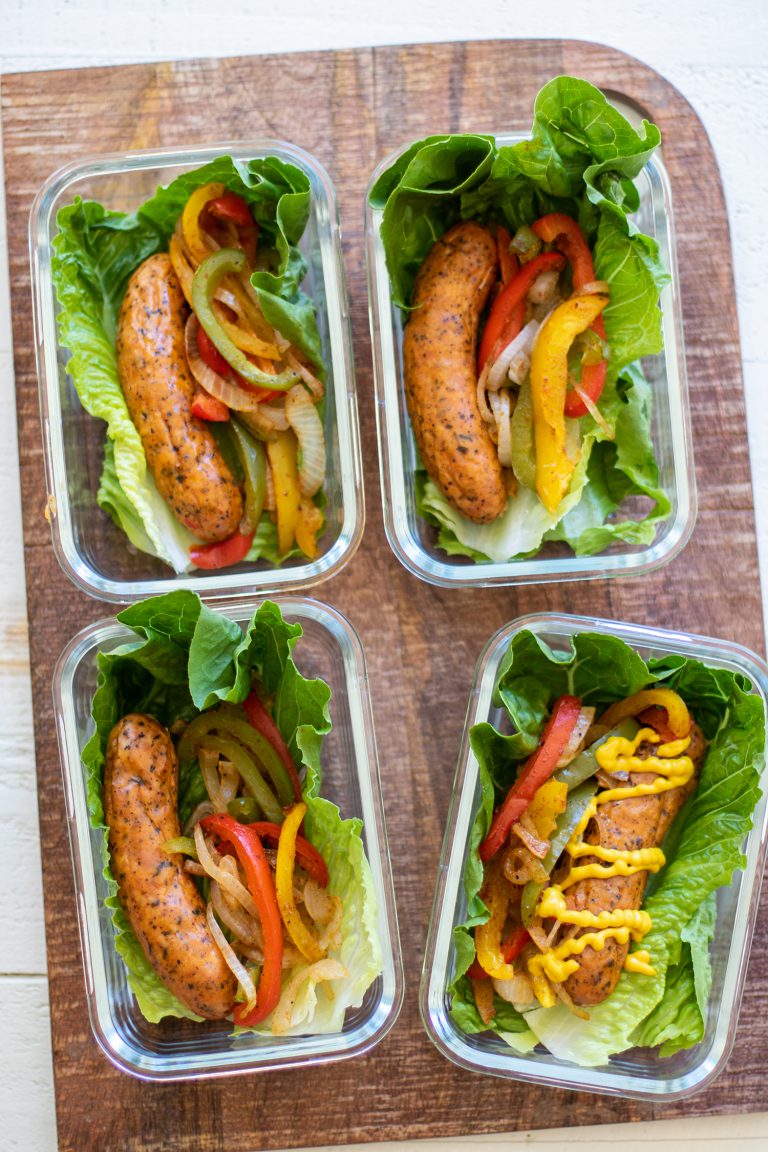 Sausage wraps in lettuce in containers.