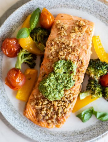 Baked Pesto Salmon and vegetables on a dish.