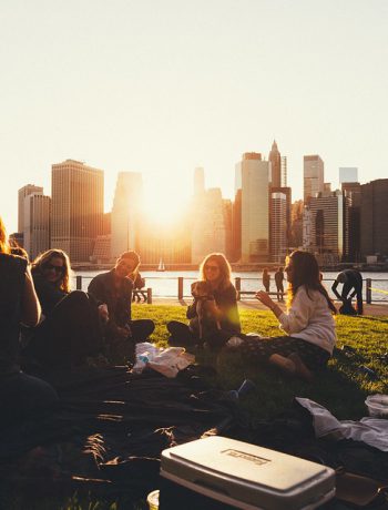 A group of friends enjoying a picnic in an urban setting.