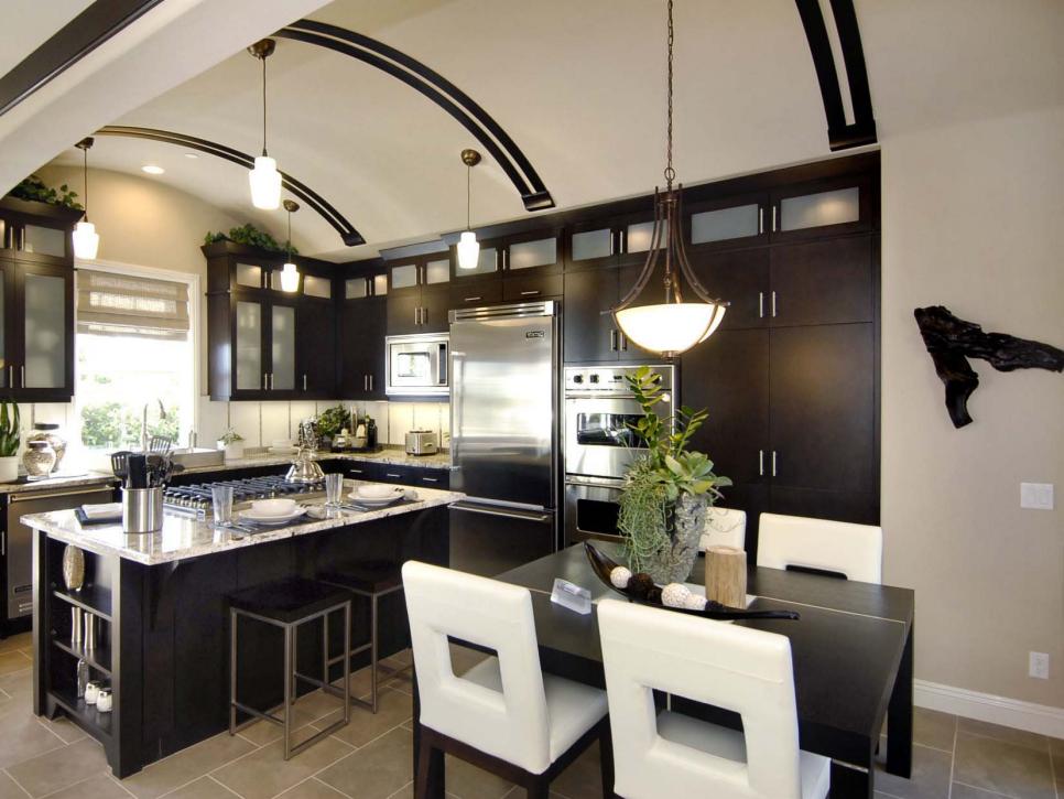 Modern dark kitchen design with curved ceiling.