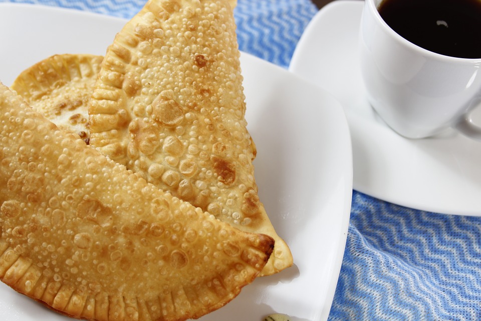 Empanadas with a cup of coffee.