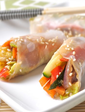 Spring rolls on a white plate.