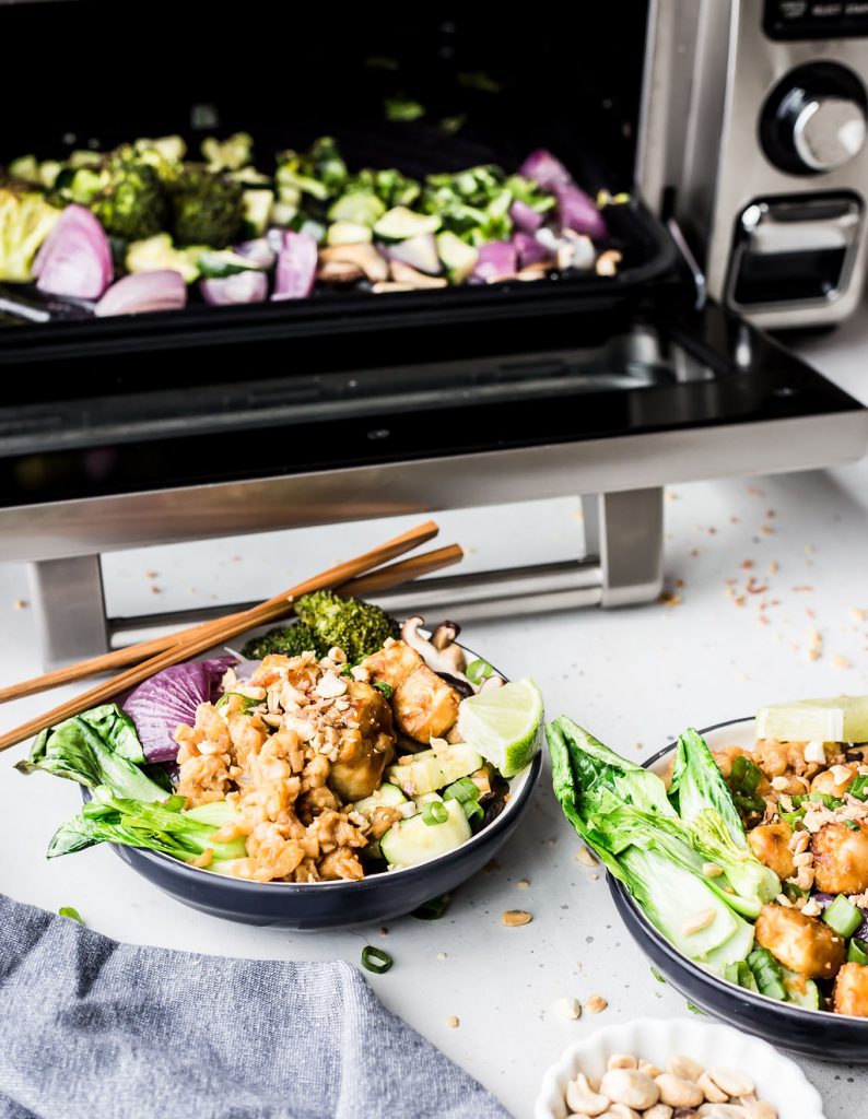 Sriracha Peanut Cauliflower Rice Bowls in front of a Sharp Supersteam Countertop Oven.